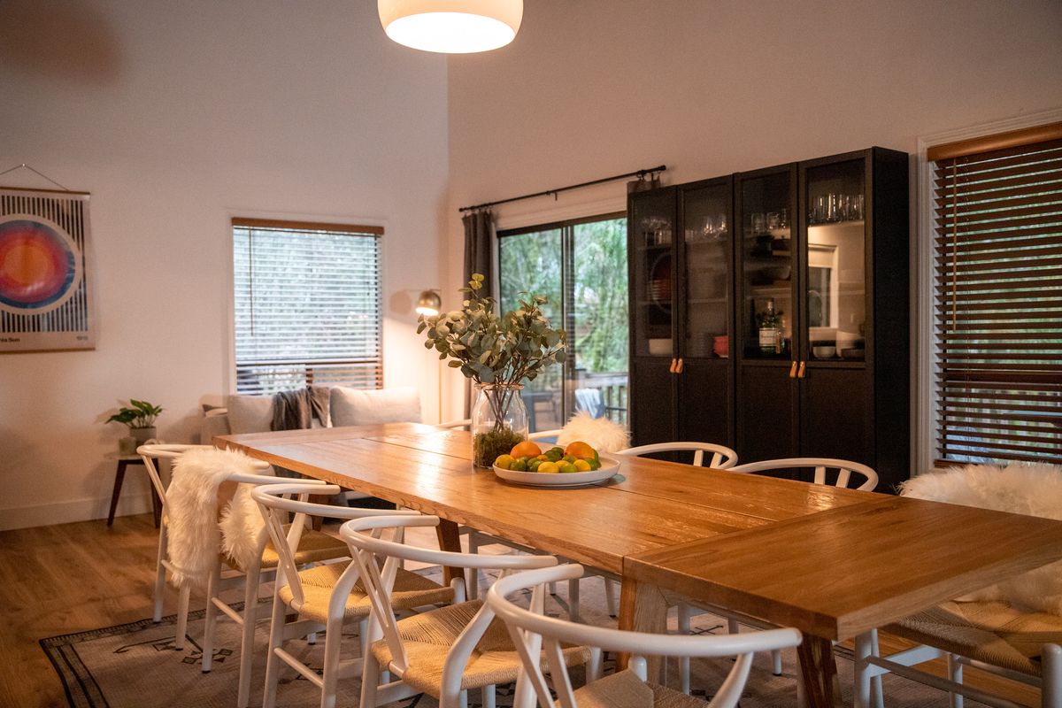 Dining room with black cabinets and garden views