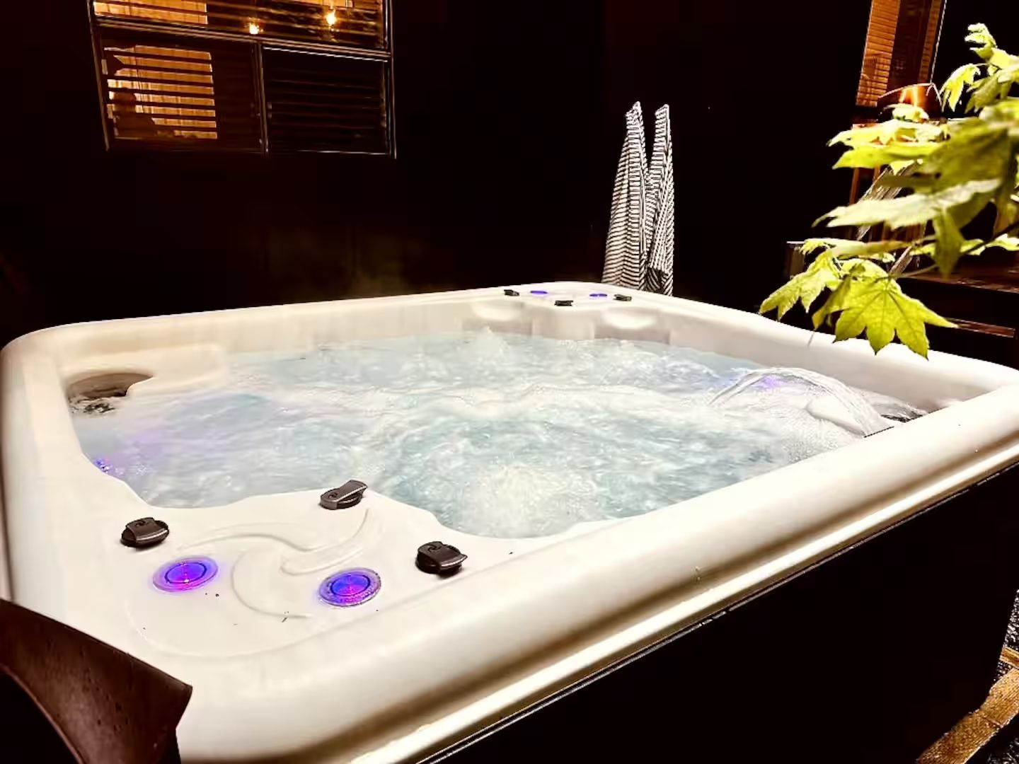 Private hot tub with jets and towel hooks