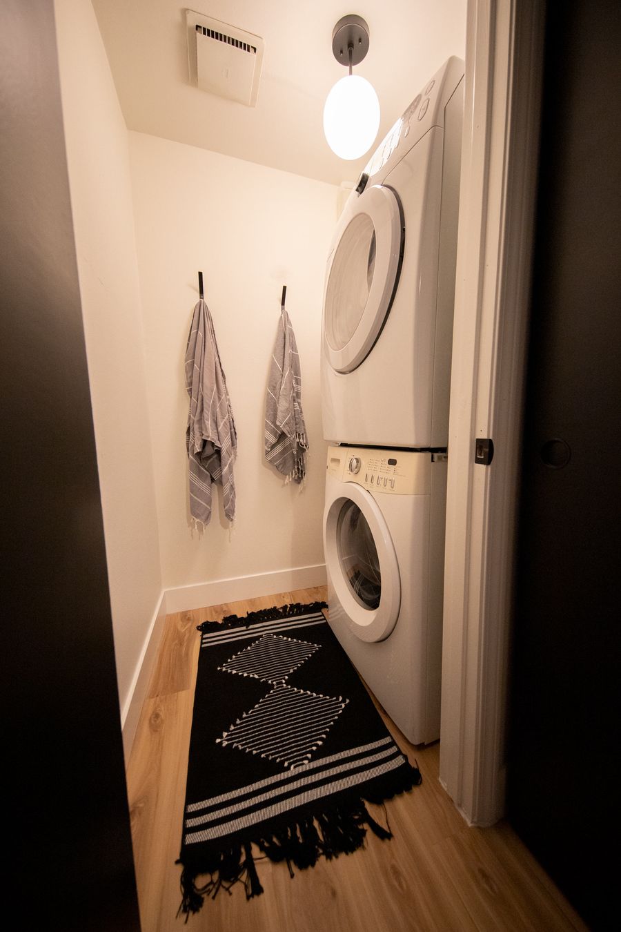 Laundry with a stacked washer and dryer