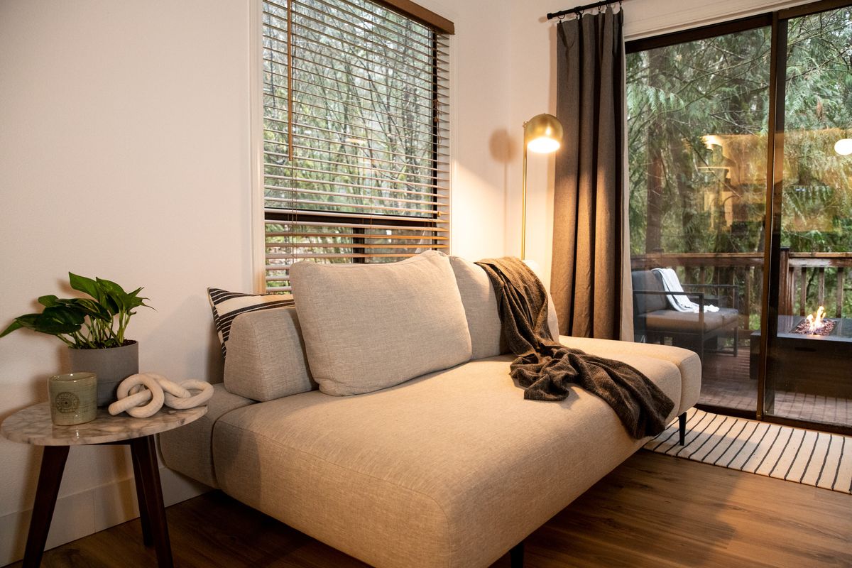 Sofa by the sliding door to the deck