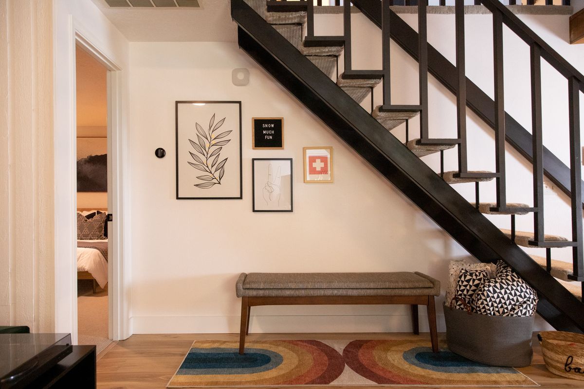 Open black staircase and bench